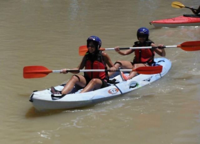  enjoying a tour on the guadalquivir in a two-seater boat 